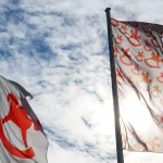 Picture of two flags witht the Toy Fair Nuremberg Logo